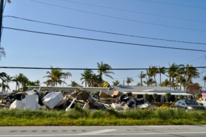 Piles of damaged property along the side of the highway after hurricane Irma.