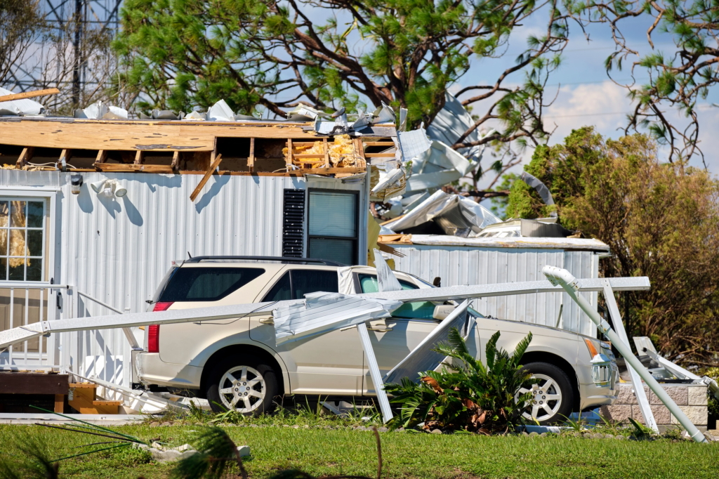 Severely damaged by hurricane Ian house and vehicle in Florida